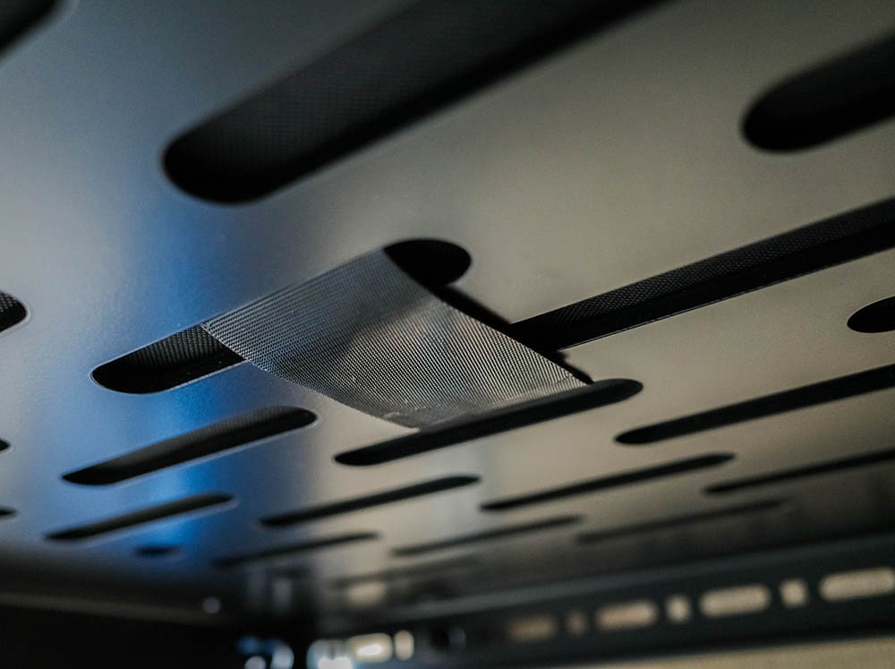 Sewn-in Velcro strap securing the mattress to a Flatline bed platform