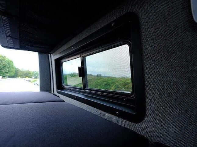 CRL pill window trim installed in a Sprinter adventure van