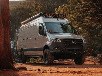 Sprinter adventure van with Flatline side steps, front bumper and Safari roof rack