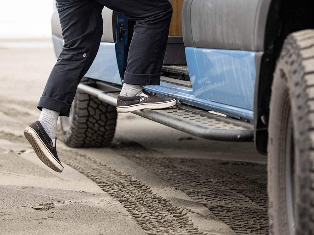 Person stepping on Flatline side step on a Sprinter 170"