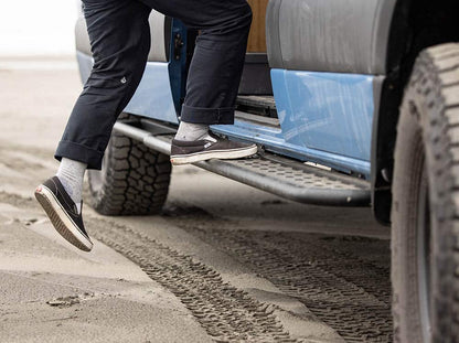Person stepping on Flatline side step on a Sprinter 170"