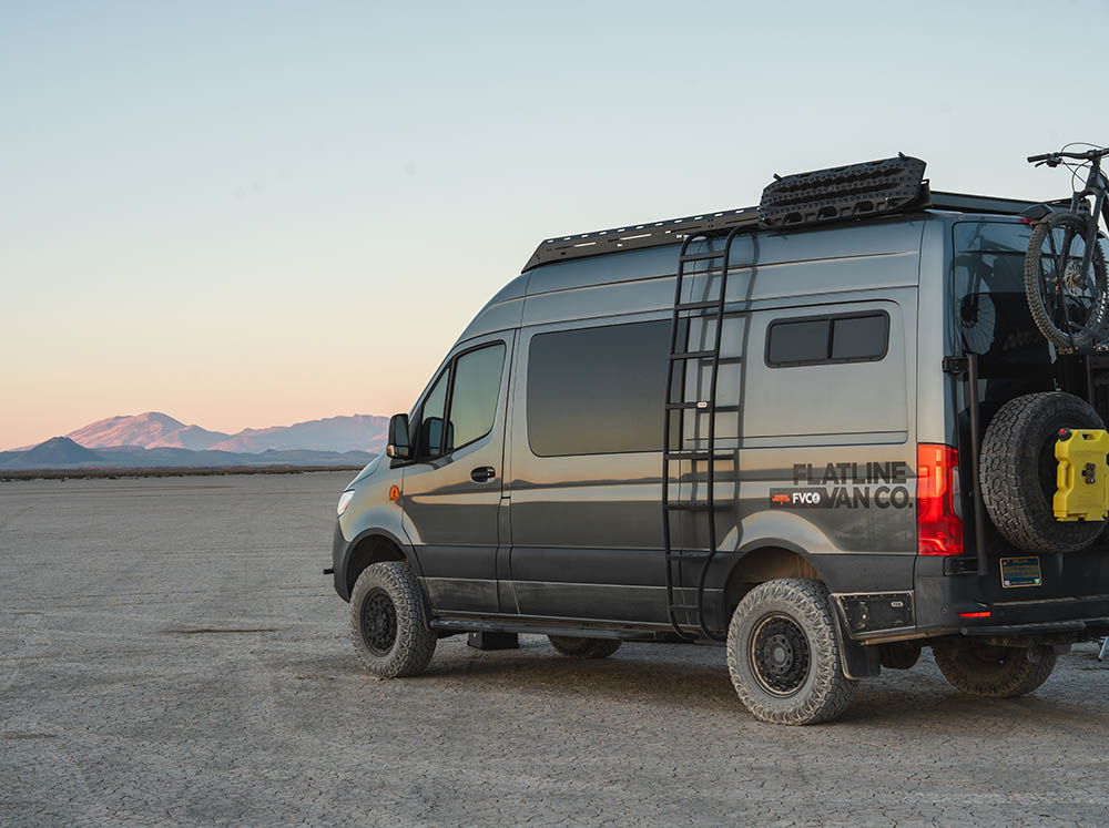Sprinter adventure van with Flatline Wheel Wrap Ladder in the desert