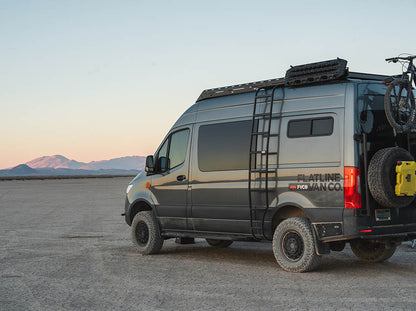 Sprinter adventure van with Flatline Wheel Wrap Ladder in the desert