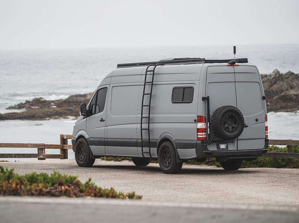 Sprinter 170" camper van with Flatline Side Ladder at the beach